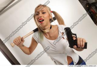 NIKOL WITH BASEBALL BAT AND GUN